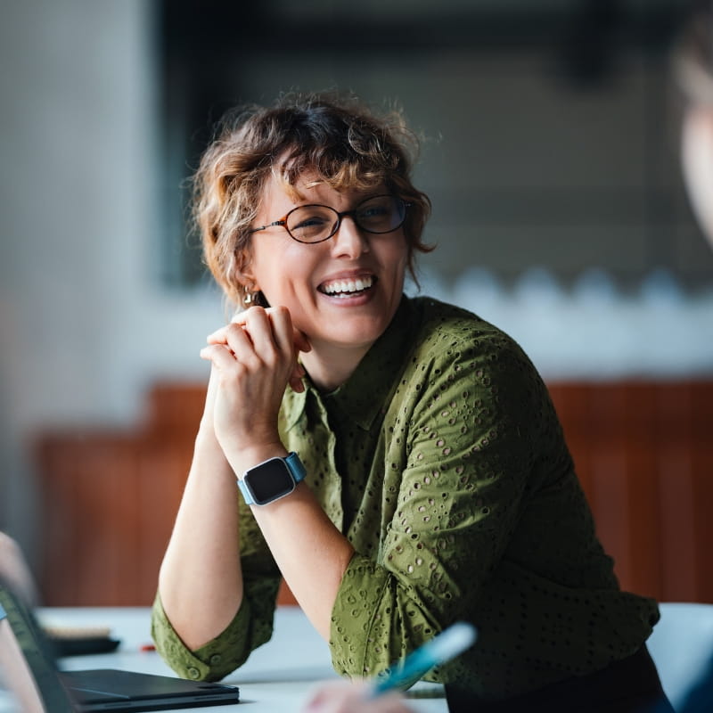 Smiling woman sitting at desk