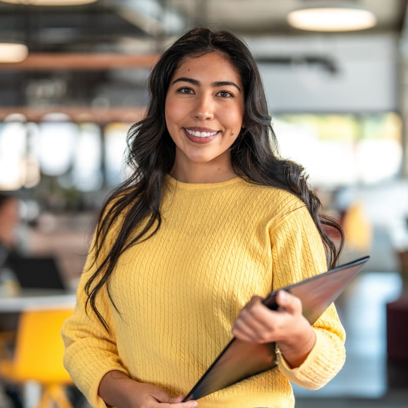 Smiling woman holding tablet