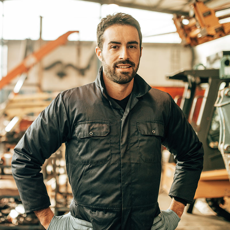 Man wearing jacket with hands on hips