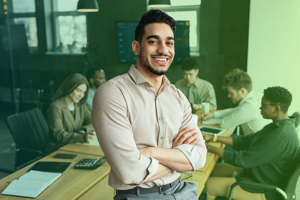 Happy businessman proud of his secure work environment thanks to ISO 27001 certification