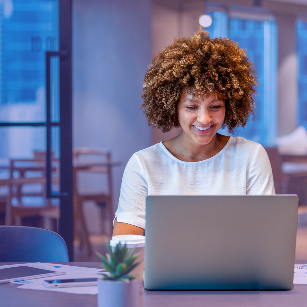 Business owner using laptop at desk