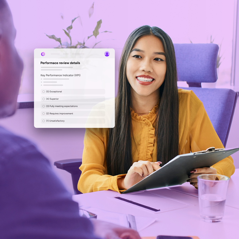 Manager discussing employee performance using employee management software