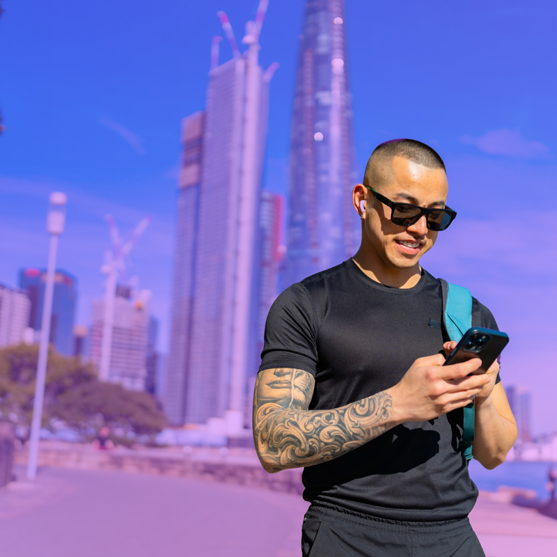Man using mobile device to review HR software cost