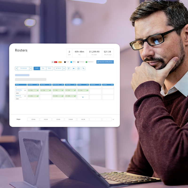 Businessman using rostering software