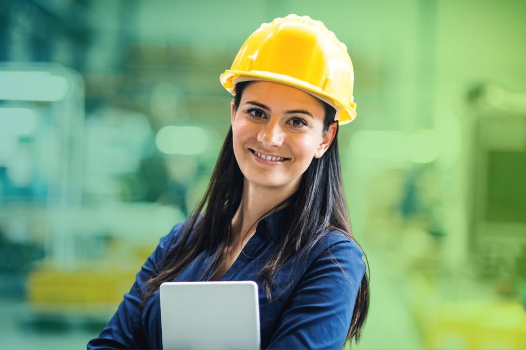 Smiling woman holding a tablet in an office setting