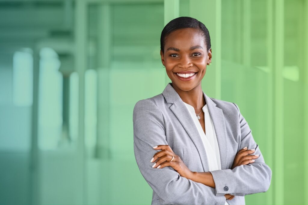 Smiling woman with arms folded