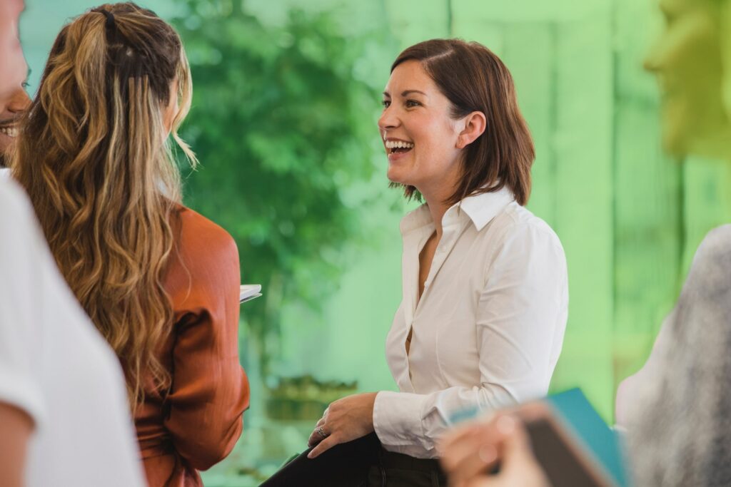 Colleagues laughing in an office setting
