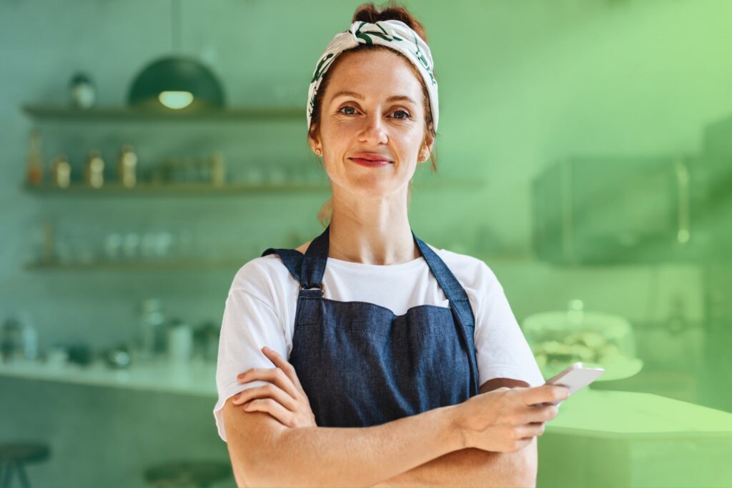 Smiling woman with arms folded