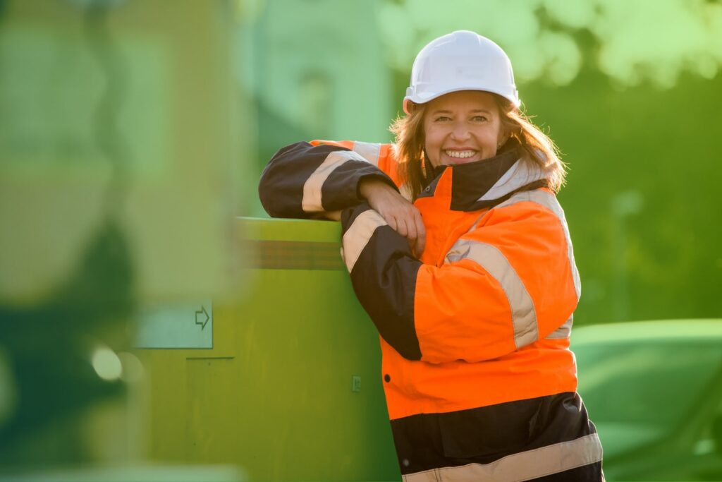 Woman in high vis and a hard hat
