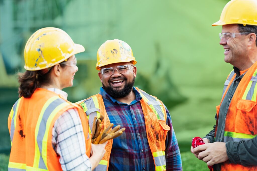 Three colleagues in hard hats
