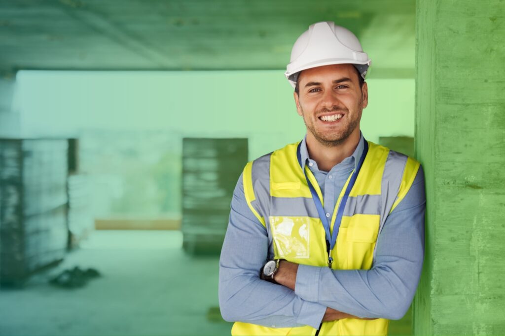 Smiling man with arms folded