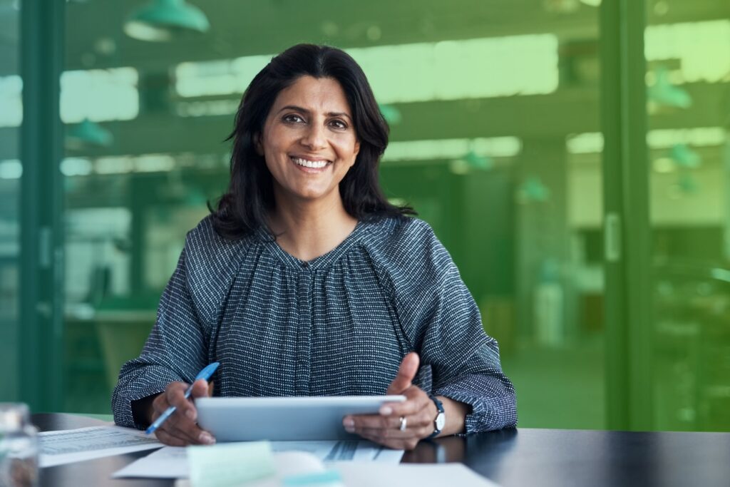 Smiling woman using a tablet