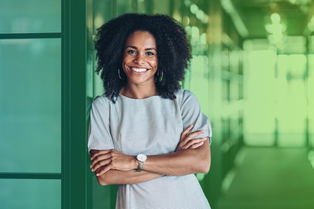 Smiling woman with arms folded