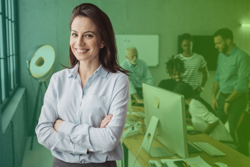 Businesswoman smiling with arms crossed