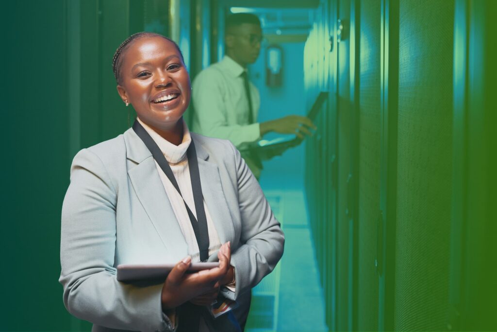 Smiling woman holding a tablet in an office setting