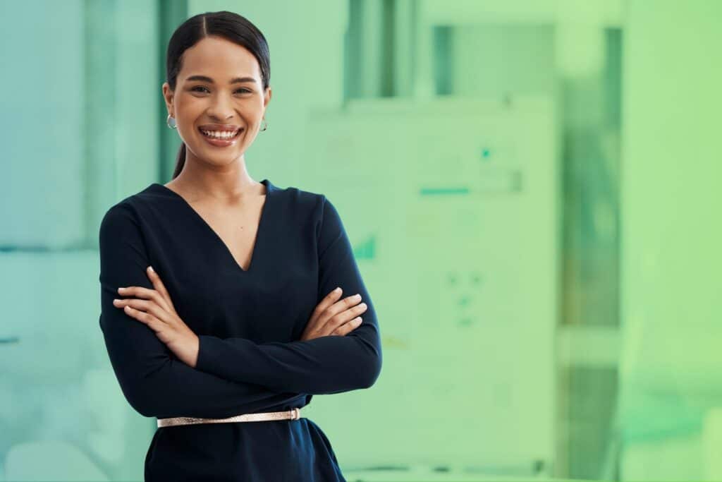 Smiling woman with arms folded
