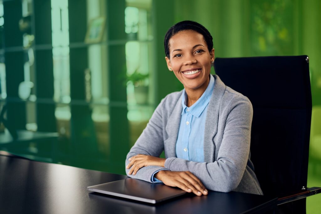 Smiling woman with arms folded
