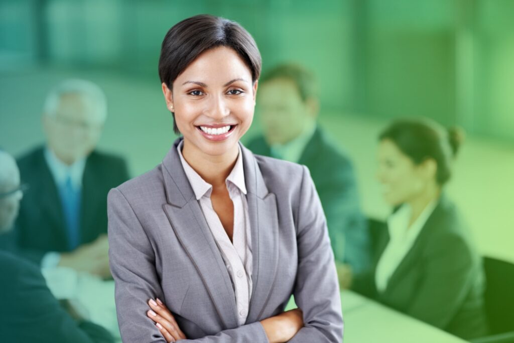 Businesswoman smiling with arms crossed