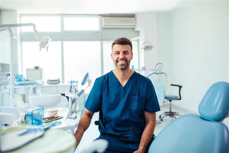 Healthcare professional in blue scrubs