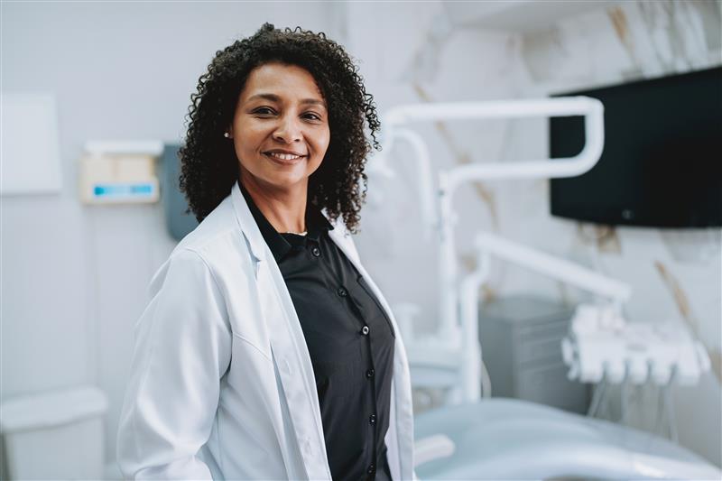 Healthcare professional smiling in a medical clinic